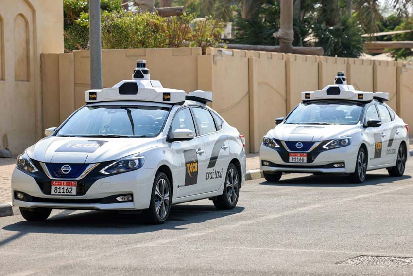 Self-driving cars with lidar driving down a road