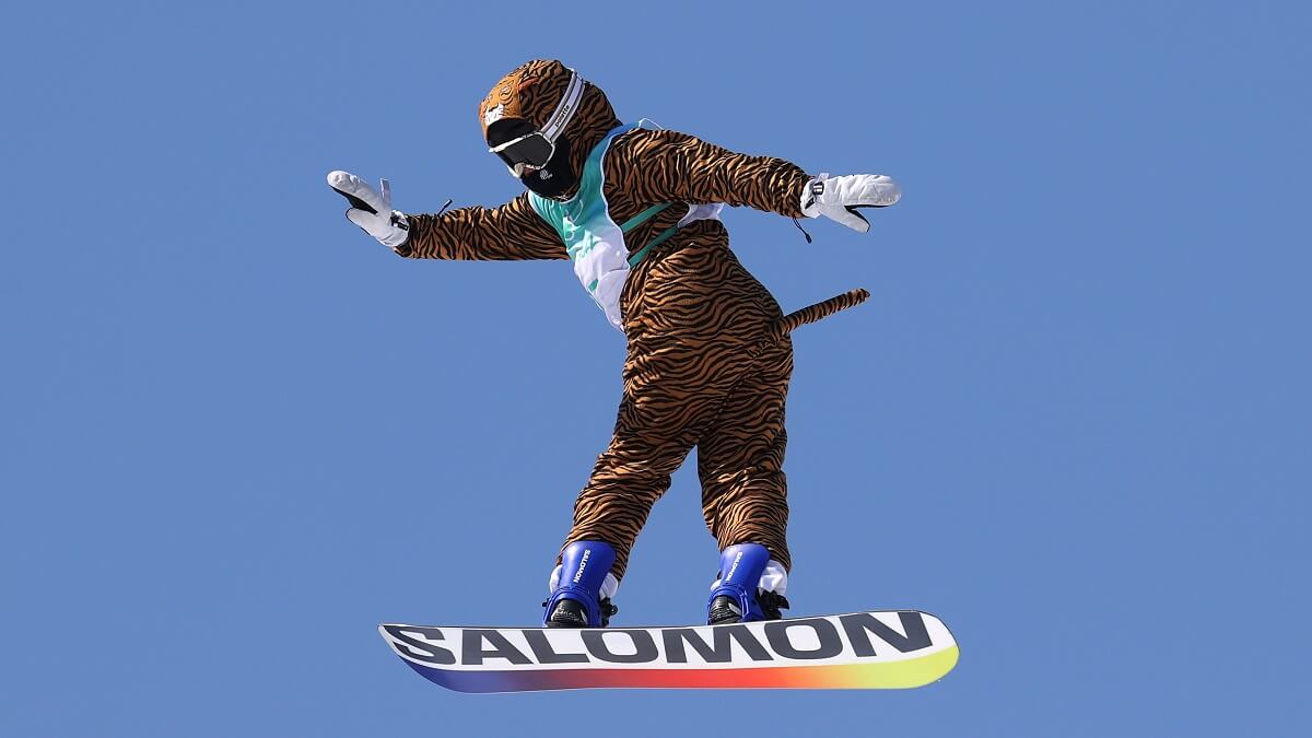 snowboarder in mid-air in tiger suit