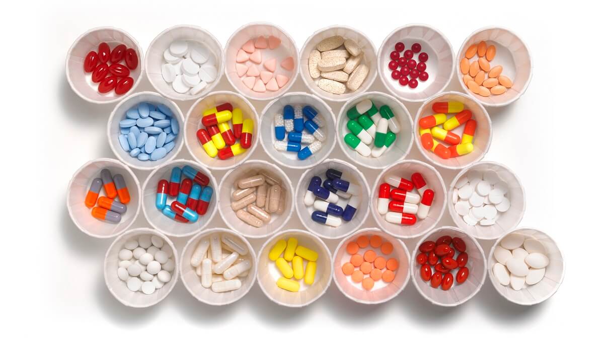 rows of medications in cups