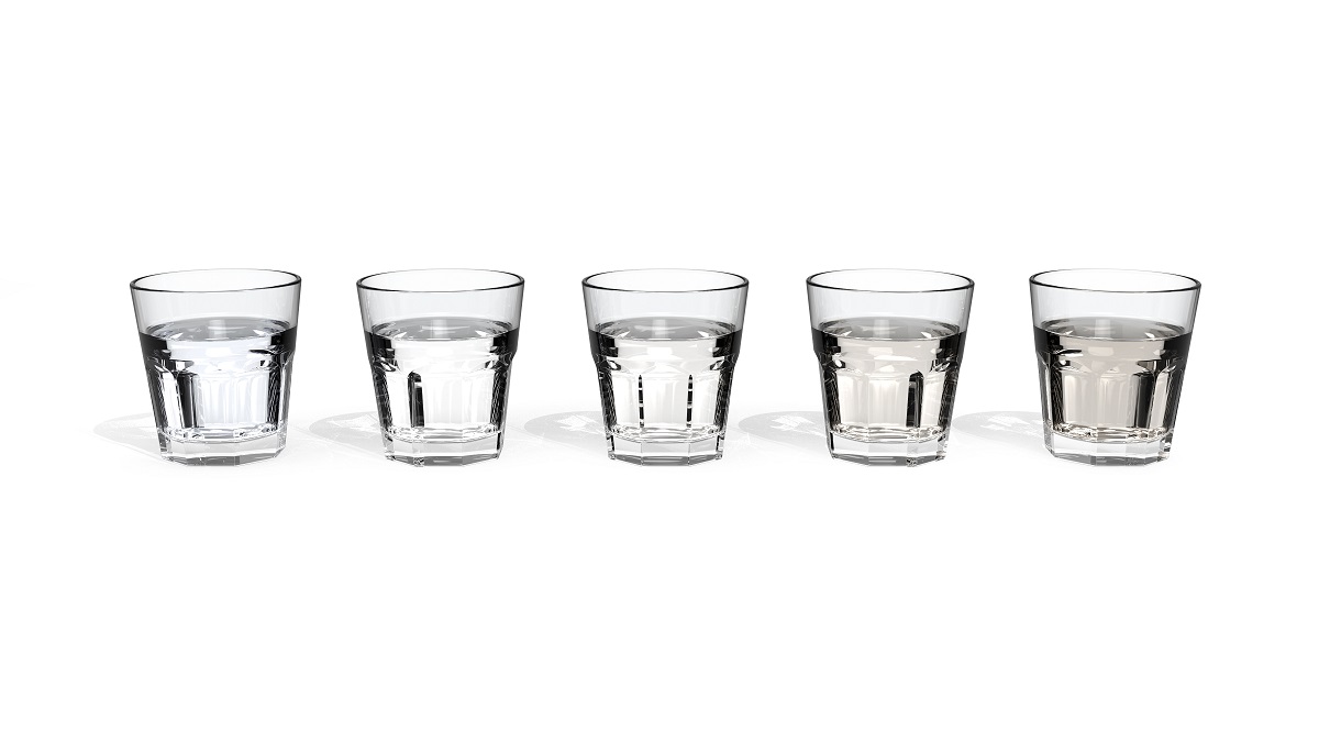 five glasses of water with different quality and colour