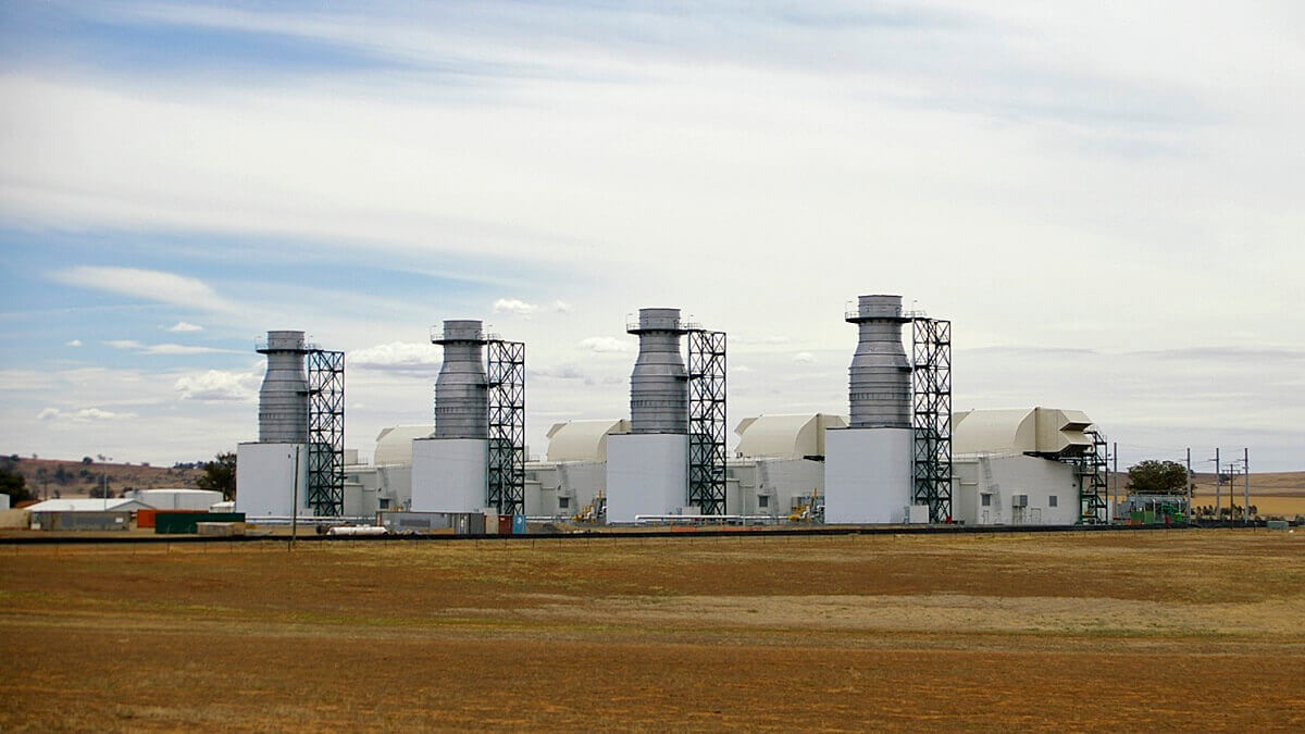 gas staition on dry field with four towers