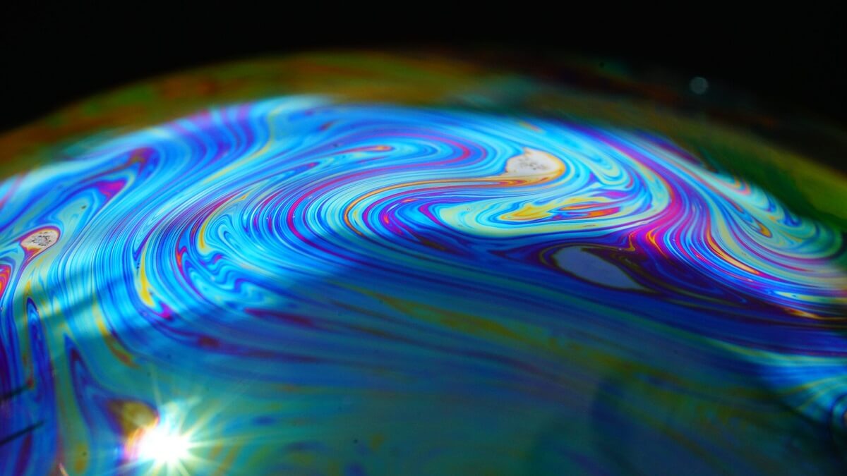 Multi coloured turbulent flowing liquid