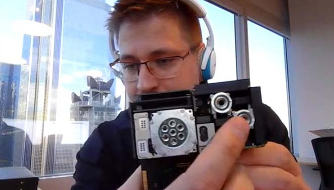 Screencap of a video call with morpheus space president istvan lorincz holding a cube propulsion module