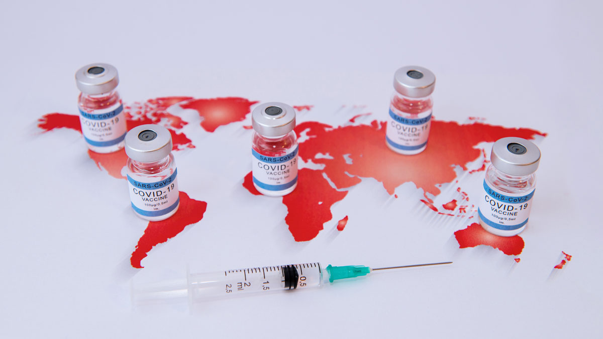 new covid-19 vaccine to vaccinate the world concept covid-19 vaccines on a world map