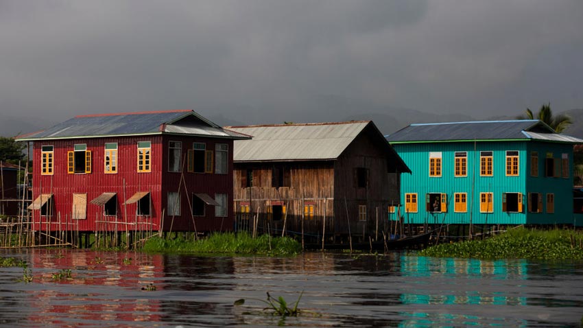 Colourful houses on stilts built around a lake
