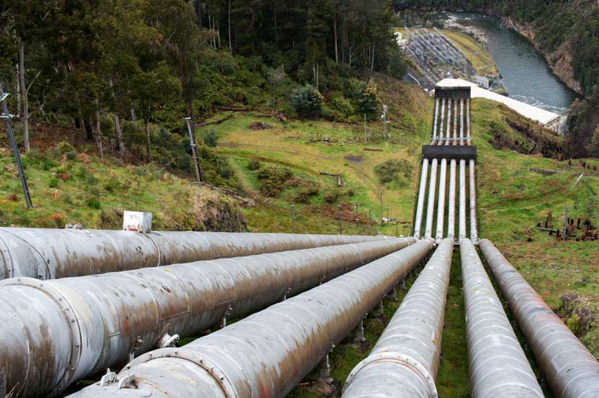 Photo of water pumps going uphill from a reservoir in a pumped hydroelectric storage system