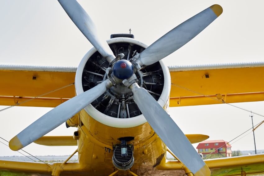 Wagon-wheel effect concept the propeller on the front of a yellow aeroplane