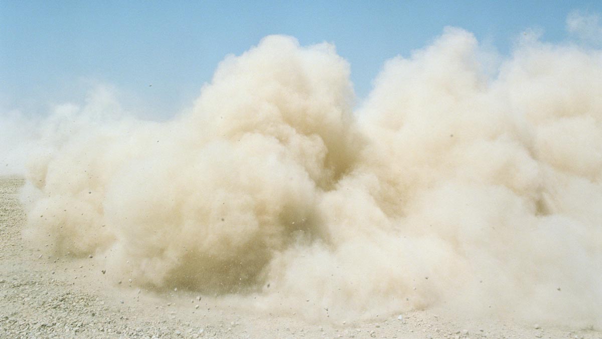 global dust cycle concept photograph of a large dust cloud on dry land
