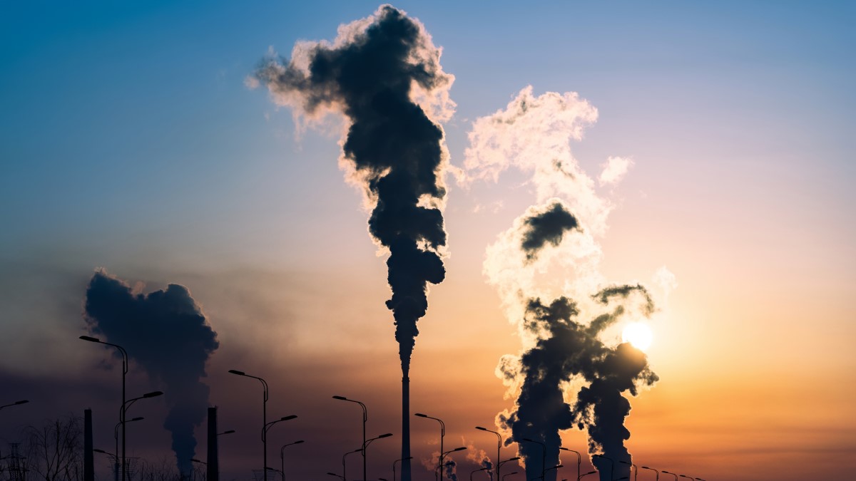 pipes pumping carbon emissions into atmosphere