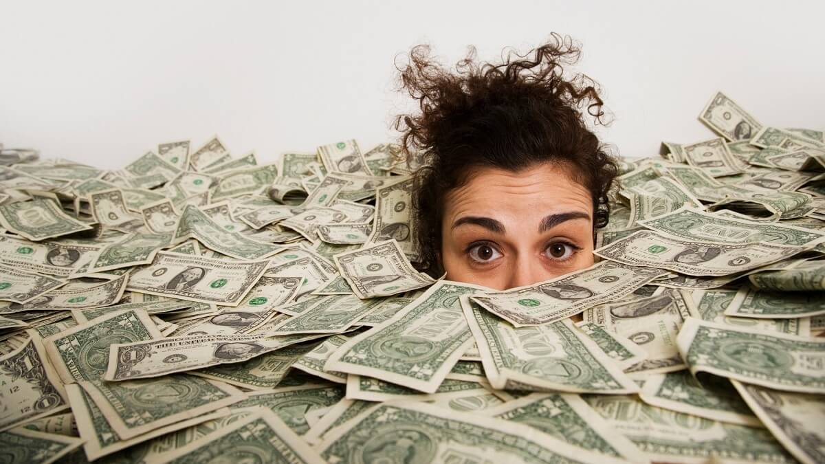 Woman buried up to her eyes in cash