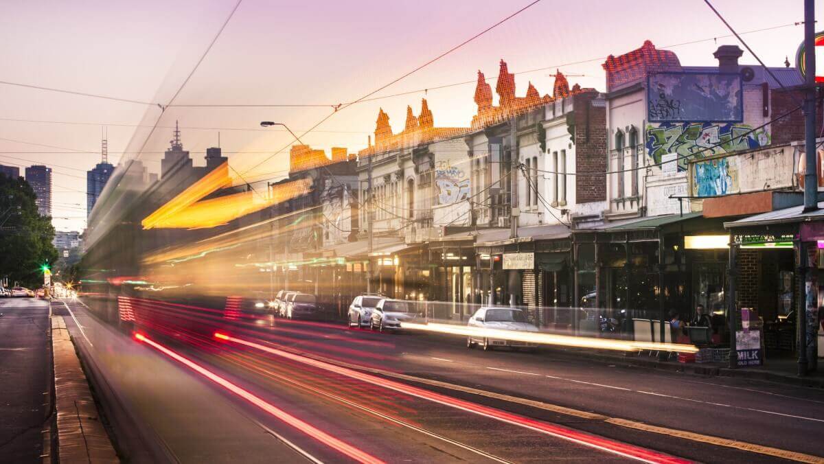 coloured lines from tram lights superimposed on Nicholson Street