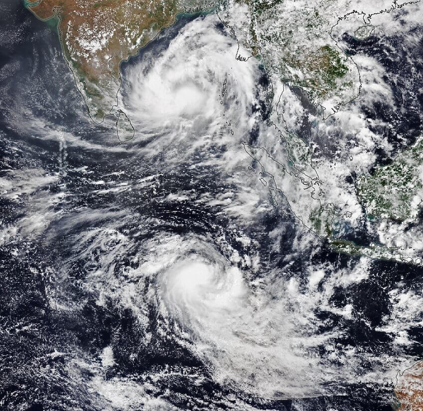 Satellite image of two cyclones in the indian ocean, south of bangladesh and west of australia - northern cyclone twists anticlockwise, southern twists clockwise