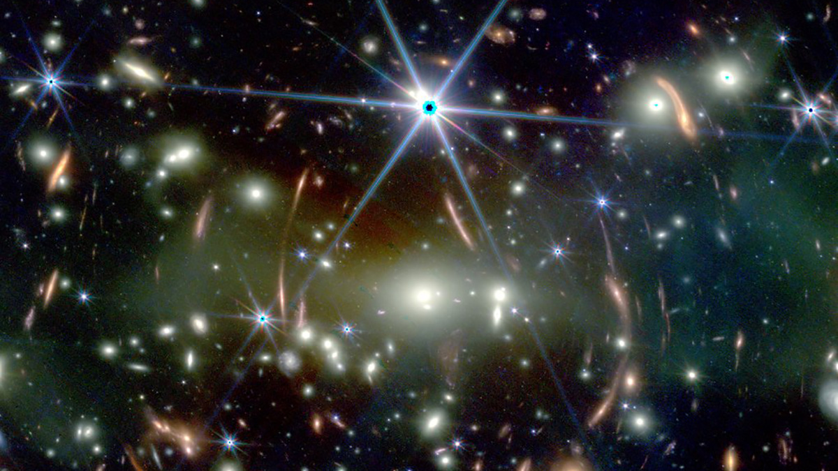One large star with six points and many blurred yellow and white spots on the bakground