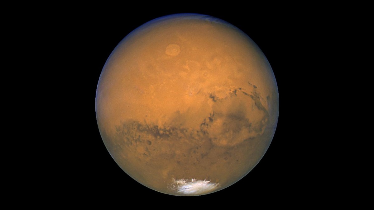 Mars, red planet with ice cap visible