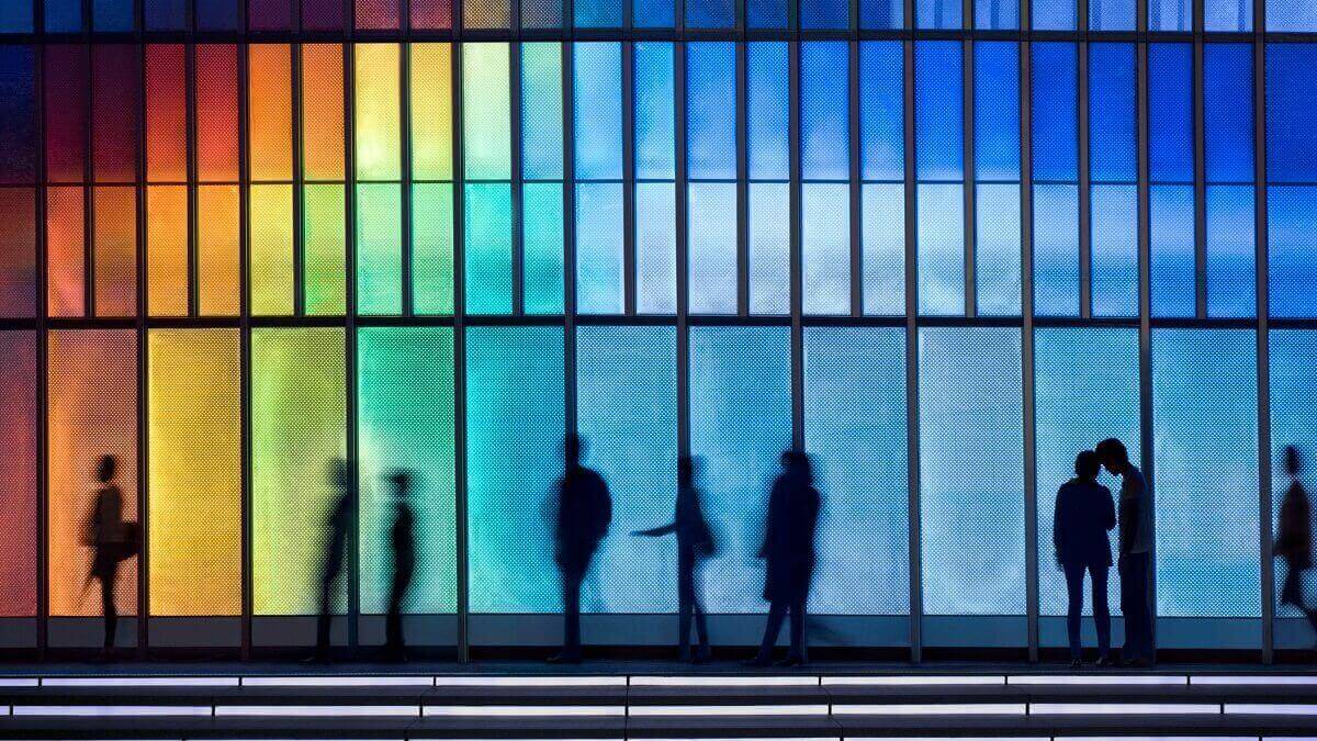 People's silhouettes in coloured LED lighting