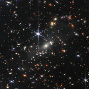 Galaxies are smeared by galaxy cluster and associated dark matter graviational lensing in jwst first deep field image