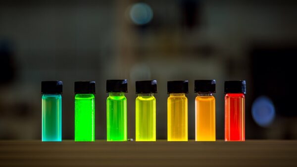 Different colours of vials lit by quantum dots