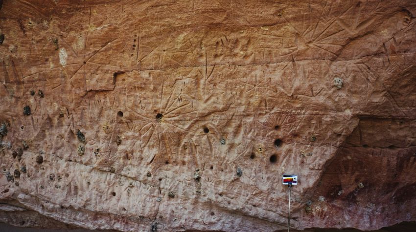 Rock art at marra wonga depicting stars arranged in three rows