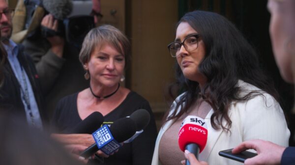 Kathleen Folbigg's next-of-kin Tracey Chapman (L) watches as lawyer Rhanee Rego addresses the media outside of the Folbigg inquiry.