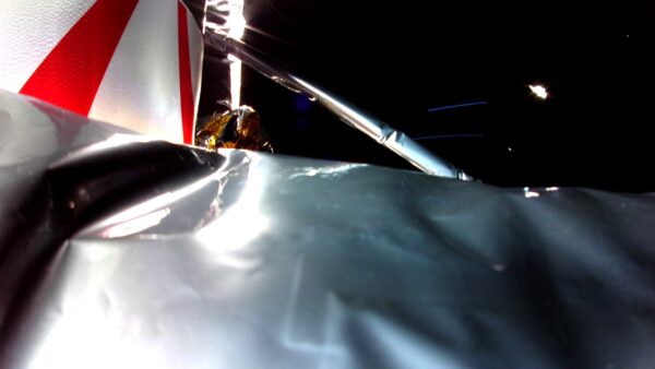 Side view of the Astrobotic Peregrine space craft from a rear view camera in space.