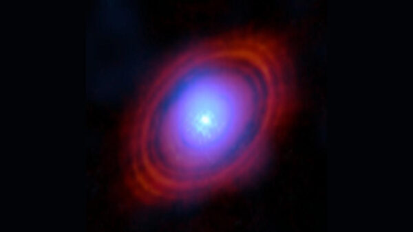 Image of a bright star surrounded by rings of red gas