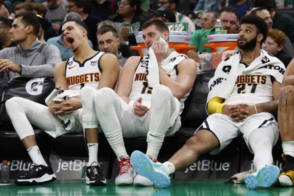 Fatigued NBA players on the bench